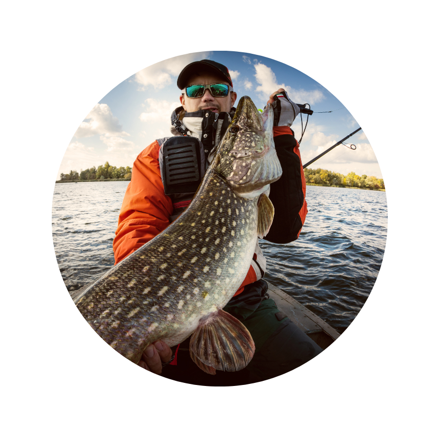 Lady Evelyn angler holding large northern pike before releasing