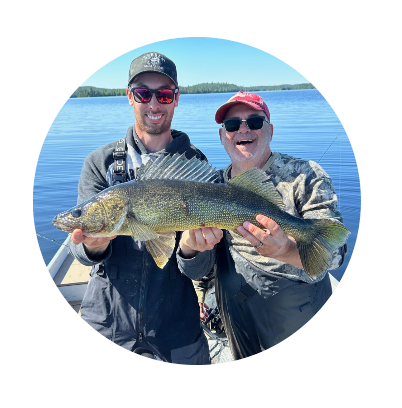 Happy angler with guide displaying nice Lady Evelyn walleye.